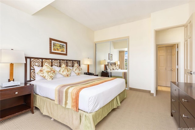 229 Paoakalani Ave Unit 3801, Honolulu, HI 96815 - bedroom featuring light carpet, a closet, and baseboards