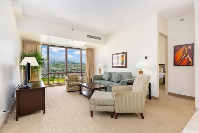 229 Paoakalani Ave Unit 3801, Honolulu, HI 96815 - living area featuring light carpet, baseboards, and visible vents