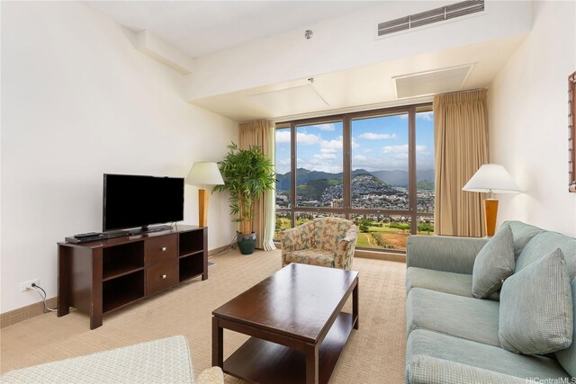 229 Paoakalani Ave Unit 3801, Honolulu, HI 96815 - living area featuring baseboards, expansive windows, visible vents, and light colored carpet