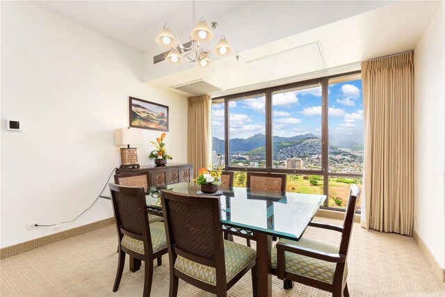 229 Paoakalani Ave Unit 3801, Honolulu, HI 96815 - dining area with floor to ceiling windows, visible vents, a mountain view, a wealth of natural light, and a notable chandelier