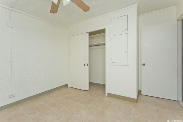 45-535 Luluku Rd Unit G2, Kaneohe, HI 96744 - unfurnished bedroom with a closet, baseboards, light tile patterned floors, and ceiling fan