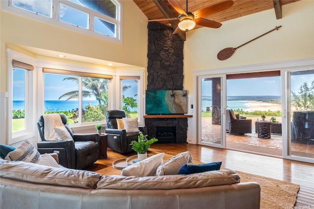 133 Kaula Ili Way, Maunaloa, HI 96770 - living area featuring wood finished floors, beamed ceiling, wood ceiling, a fireplace, and high vaulted ceiling
