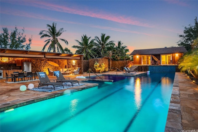 133 Kaula Ili Way, Maunaloa, HI 96770 - outdoor pool with a patio area, an outbuilding, a storage structure, and a jacuzzi