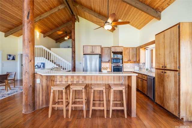 133 Kaula Ili Way, Maunaloa, HI 96770 - kitchen with a ceiling fan, wood ceiling, stainless steel appliances, light countertops, and a peninsula