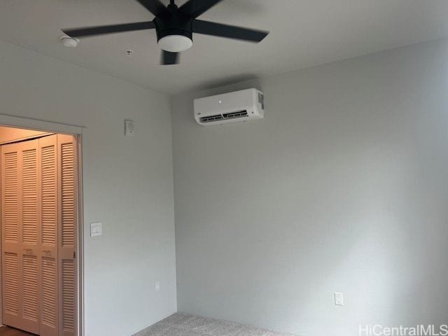 91-3575 Iwikuamoo St Unit 509, Ewa Beach, HI 96706 - unfurnished bedroom with an AC wall unit, carpet flooring, a ceiling fan, and a closet