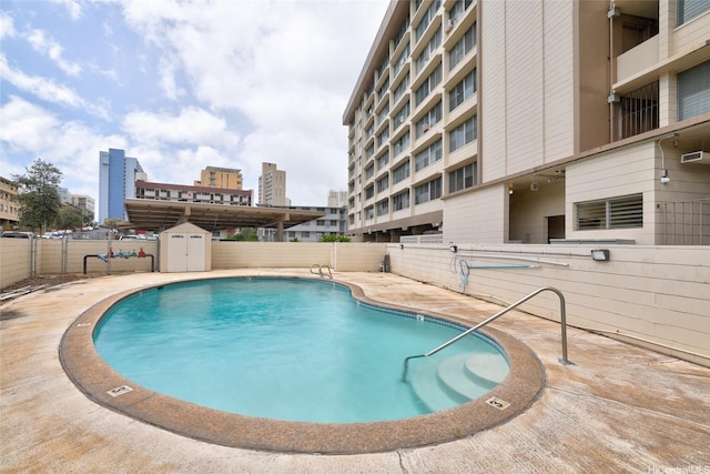 2977 Ala Ilima St Unit 805, Honolulu, HI 96818 - pool with a storage unit, an outbuilding, a patio, and fence