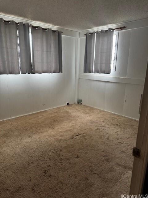 94-440 Kiau Pl, Waipahu, HI 96797 - unfurnished room with carpet floors and a textured ceiling