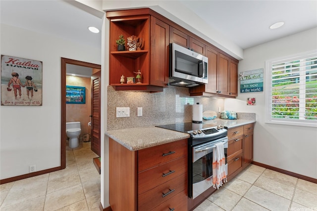 411 Kaelepulu Dr Unit E, Kailua, HI 96734 - kitchen featuring stainless steel appliances, baseboards, decorative backsplash, brown cabinetry, and open shelves