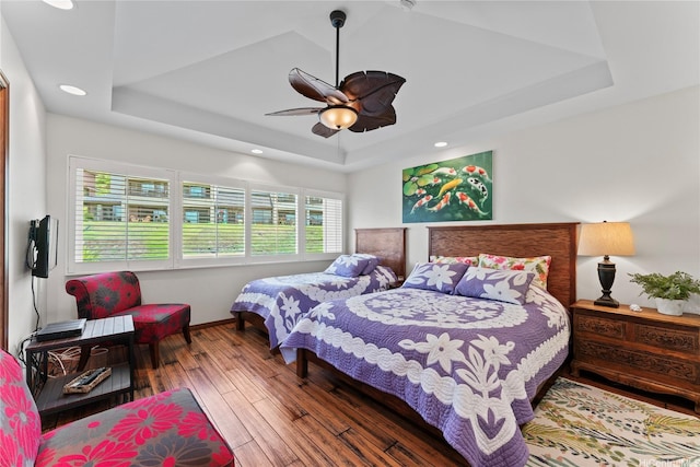411 Kaelepulu Dr Unit E, Kailua, HI 96734 - bedroom with a raised ceiling, wood-type flooring, baseboards, a ceiling fan, and recessed lighting
