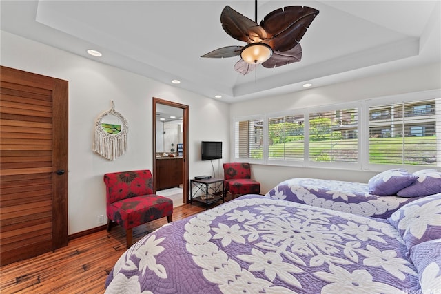 411 Kaelepulu Dr Unit E, Kailua, HI 96734 - bedroom with a tray ceiling, recessed lighting, wood finished floors, baseboards, and ceiling fan