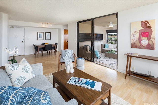 3138 Waialae Ave Unit 918, Honolulu, HI 96816 - living room featuring wood finished floors and a ceiling fan