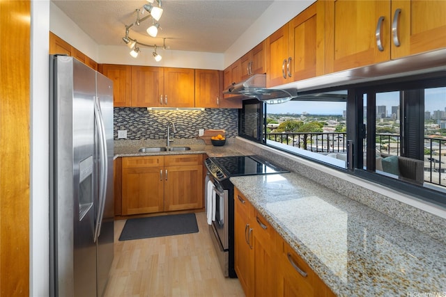 3138 Waialae Ave Unit 918, Honolulu, HI 96816 - kitchen featuring stainless steel appliances, a sink, brown cabinetry, backsplash, and light stone countertops