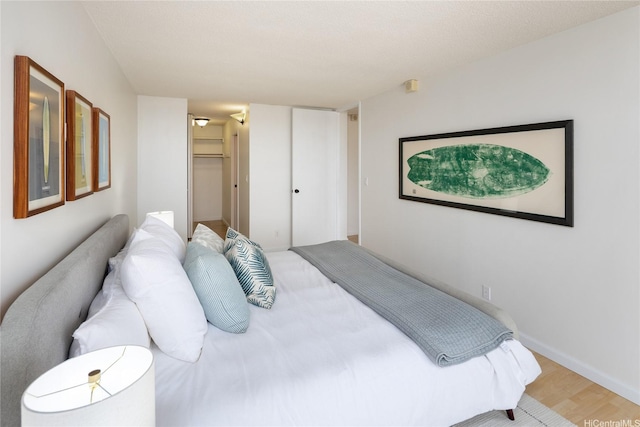 3138 Waialae Ave Unit 918, Honolulu, HI 96816 - bedroom with wood finished floors, baseboards, and a closet