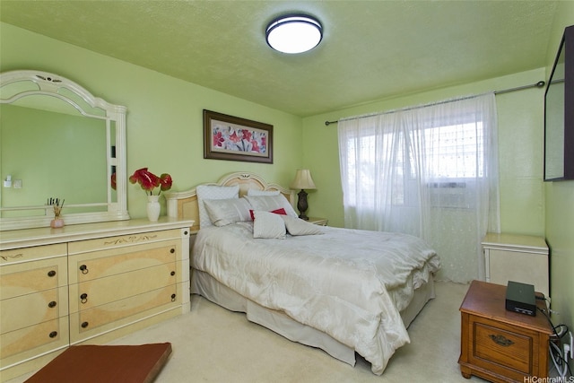 bedroom featuring light carpet