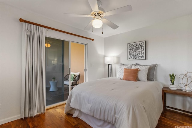 3075 Ala Poha Pl Unit 1509, Honolulu, HI 96818 - bedroom with wood finished floors, baseboards, a ceiling fan, and access to exterior