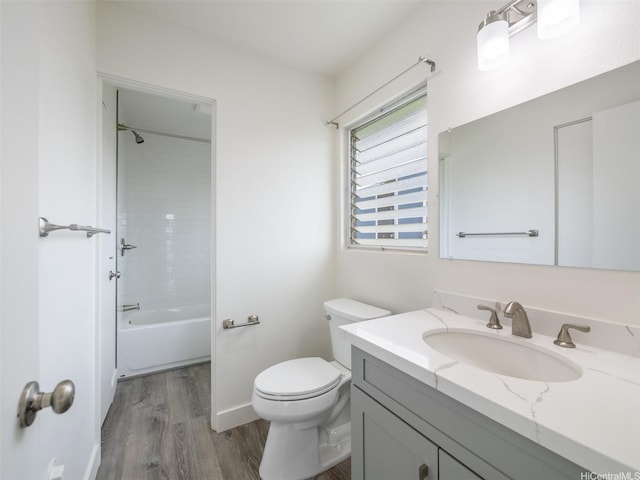 94-615 Kahakea St Unit 9G, Waipahu, HI 96797 - full bathroom featuring toilet, wood finished floors, shower / bath combination, baseboards, and vanity