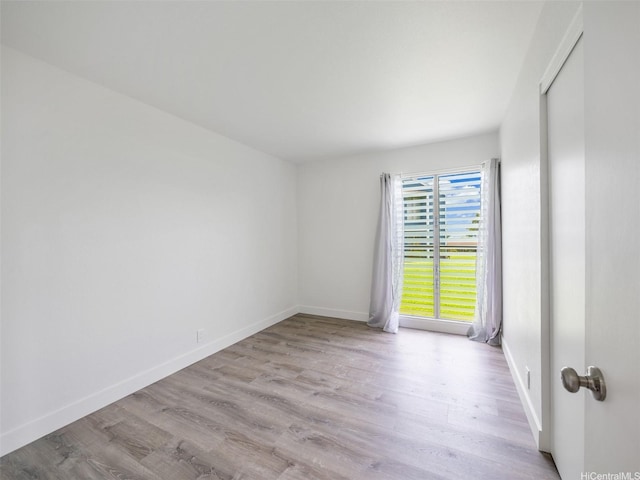 94-615 Kahakea St Unit 9G, Waipahu, HI 96797 - unfurnished room featuring baseboards and wood finished floors