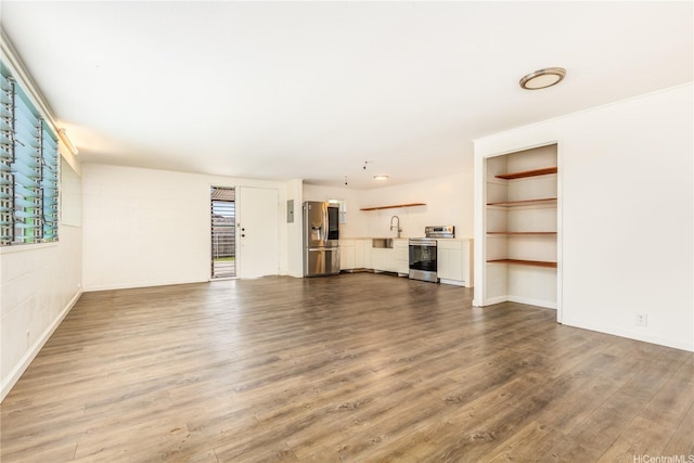 1182 Lauloa St, Kailua, HI 96734 - unfurnished living room featuring a sink and wood finished floors