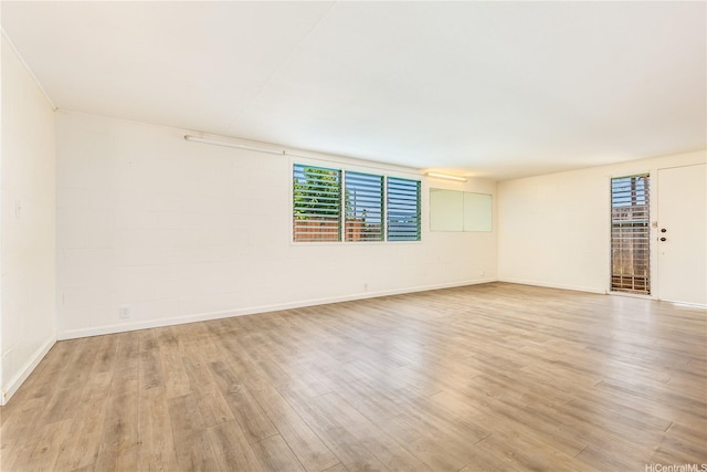 1182 Lauloa St, Kailua, HI 96734 - empty room with a healthy amount of sunlight, baseboards, and light wood-style flooring