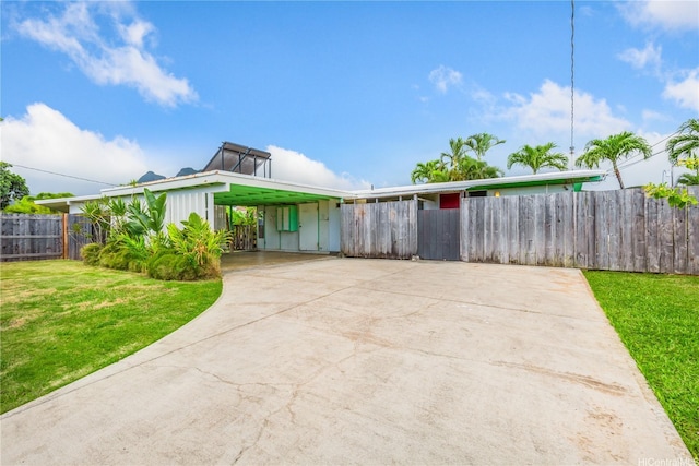 1182 Lauloa St, Kailua, HI 96734 - view of front of property featuring board and batten siding, fence, a front yard, and concrete driveway