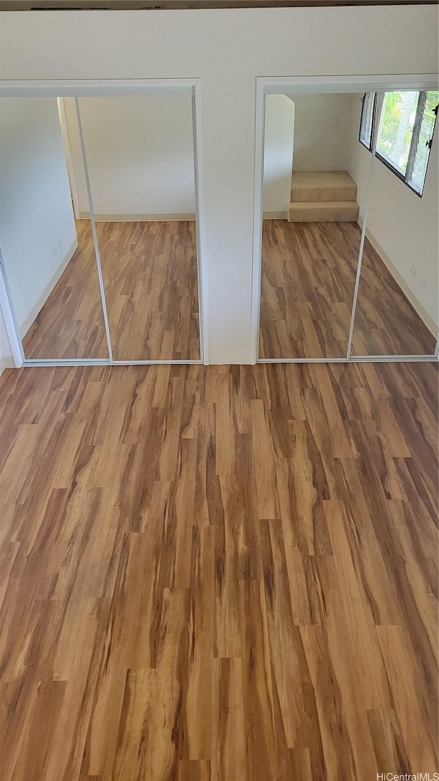 unfurnished bedroom with wood finished floors