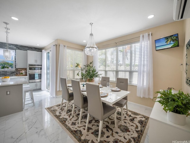 91-1075 Lanakoi St, Kapolei, HI 96707 - dining space featuring a chandelier, recessed lighting, a wall mounted AC, and light marble finish floors