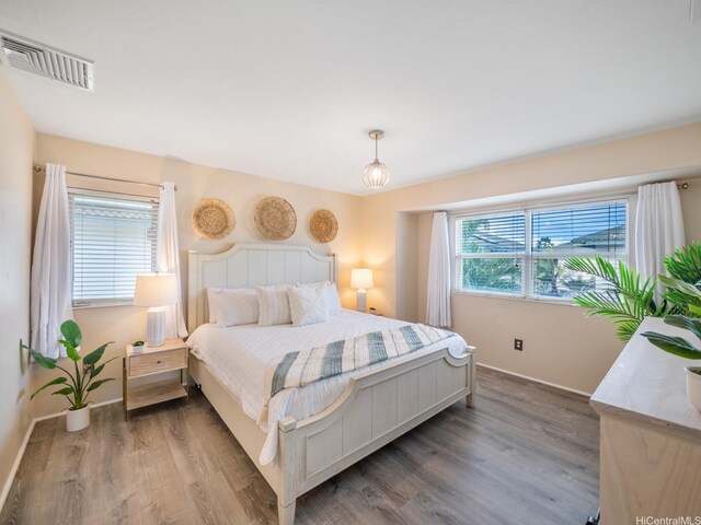 91-1075 Lanakoi St, Kapolei, HI 96707 - bedroom featuring wood finished floors and baseboards