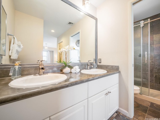 91-1075 Lanakoi St, Kapolei, HI 96707 - bathroom featuring double vanity, a stall shower, toilet, and recessed lighting
