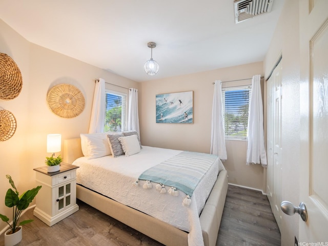 91-1075 Lanakoi St, Kapolei, HI 96707 - bedroom with wood finished floors, baseboards, and a closet