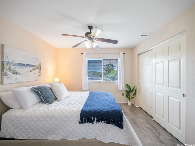 91-1075 Lanakoi St, Kapolei, HI 96707 - bedroom featuring wood finished floors, a closet, ceiling fan, and baseboards