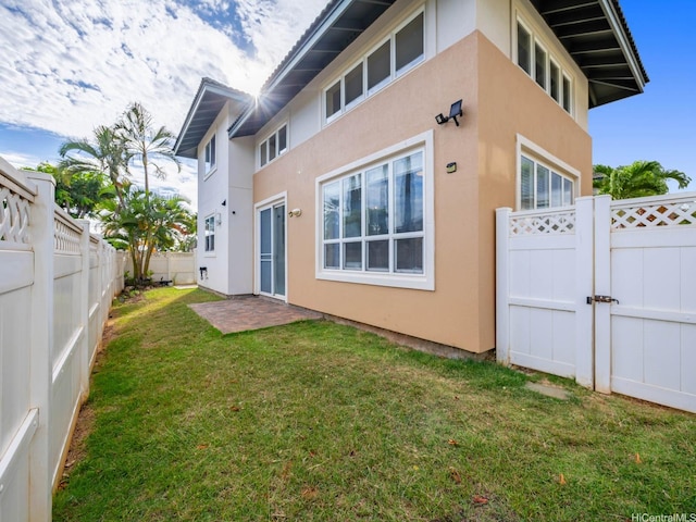 91-1075 Lanakoi St, Kapolei, HI 96707 - back of house with stucco siding and a fenced backyard
