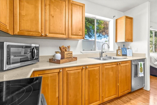 94-513 Kaikua Pl, Waipahu, HI 96797 - kitchen with light countertops, appliances with stainless steel finishes, a healthy amount of sunlight, and a sink