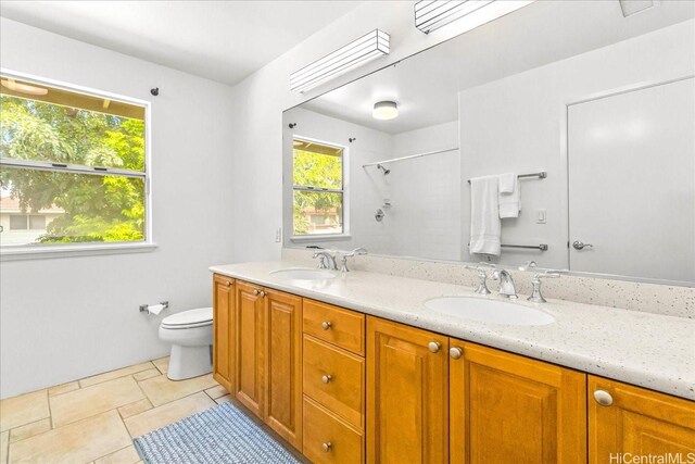 94-513 Kaikua Pl, Waipahu, HI 96797 - bathroom featuring a sink, walk in shower, toilet, and double vanity