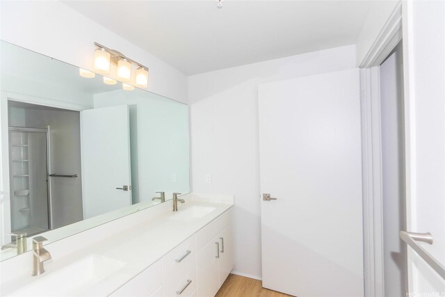 91-3641 Iwikuamoo St Unit 4302, Ewa Beach, HI 96706 - full bathroom featuring wood finished floors, a sink, and double vanity
