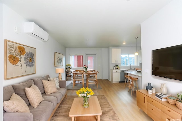 91-3641 Iwikuamoo St Unit 4302, Ewa Beach, HI 96706 - living area with light wood-style flooring and a wall unit AC