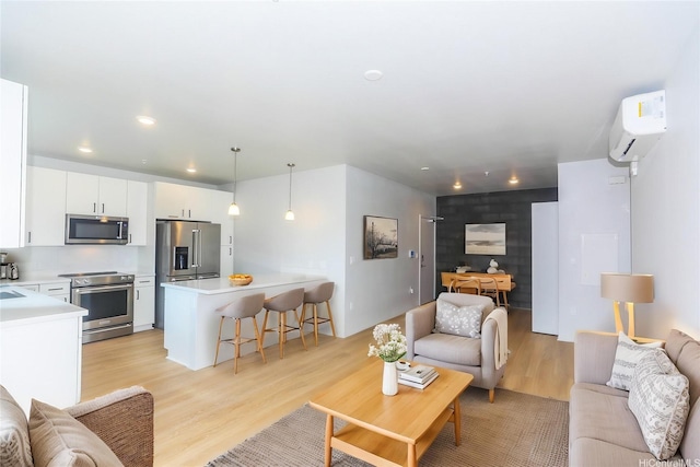 91-3641 Iwikuamoo St Unit 4302, Ewa Beach, HI 96706 - living area with recessed lighting, light wood finished floors, and an AC wall unit