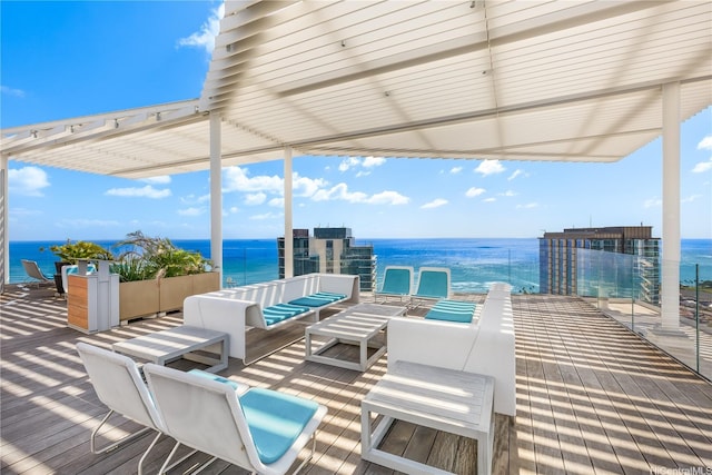 wooden terrace featuring a water view