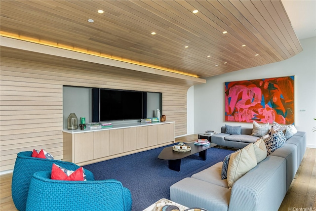 living room featuring recessed lighting, wooden walls, wood finished floors, and wooden ceiling