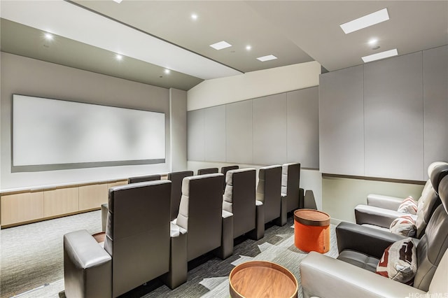 cinema featuring recessed lighting, lofted ceiling, and light carpet