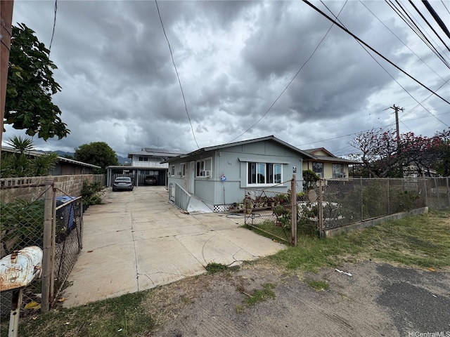 view of front of property with fence private yard and concrete driveway