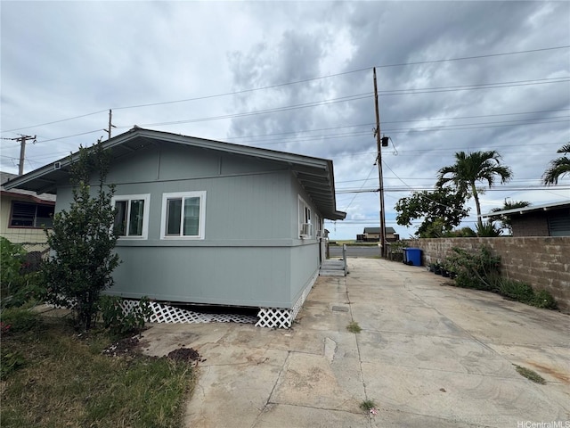 view of property exterior featuring fence