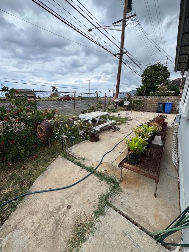 view of patio featuring fence
