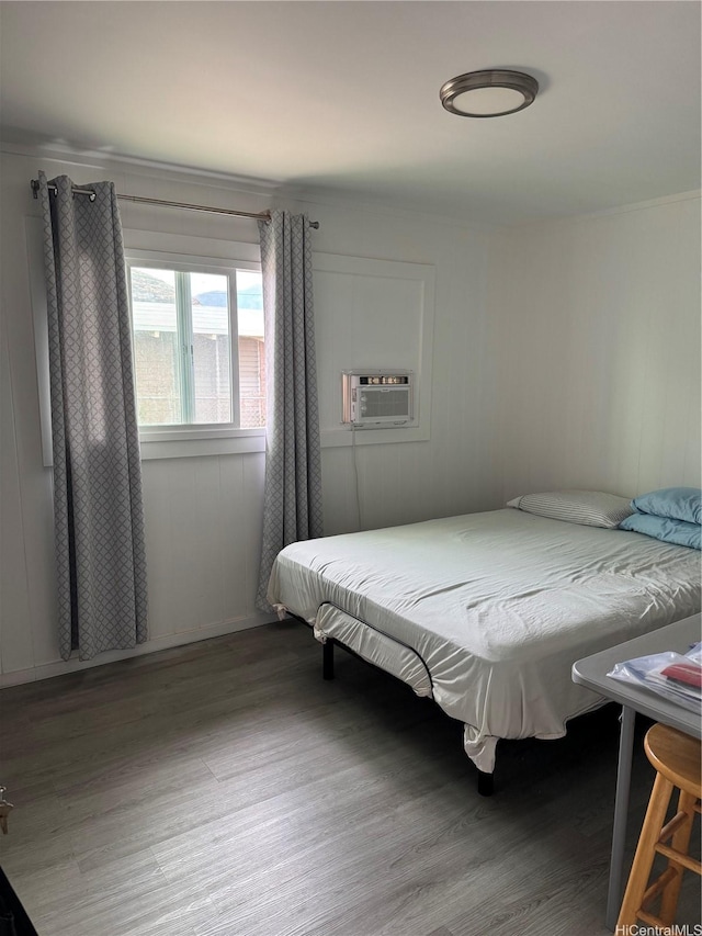 bedroom with wood finished floors