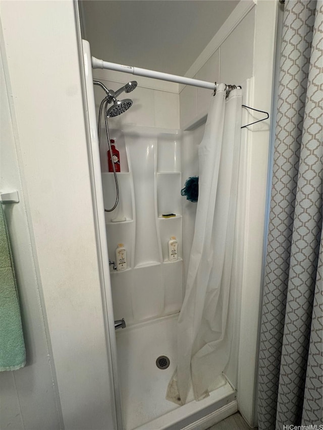 bathroom featuring a shower stall