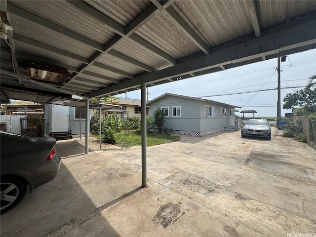 view of patio / terrace with an outbuilding, a shed, and fence