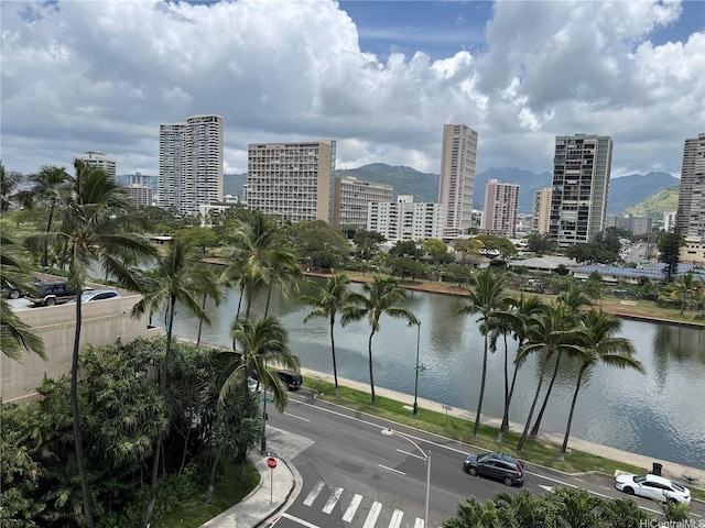 water view with a city view and a mountain view