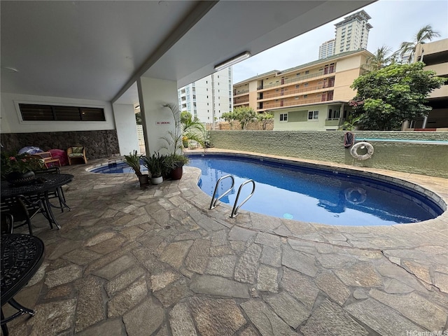view of pool featuring a fenced in pool and a patio area