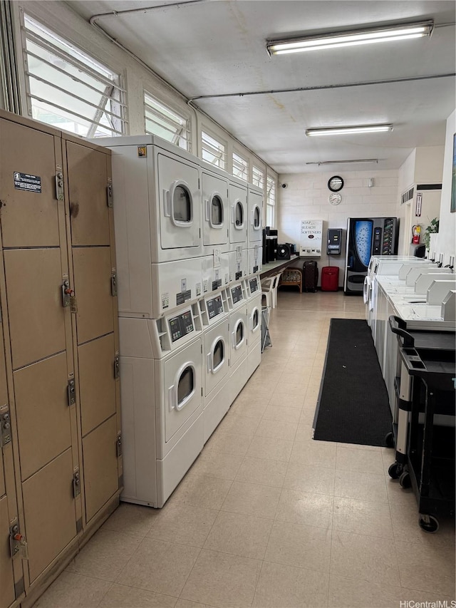 shared laundry area with stacked washer / dryer