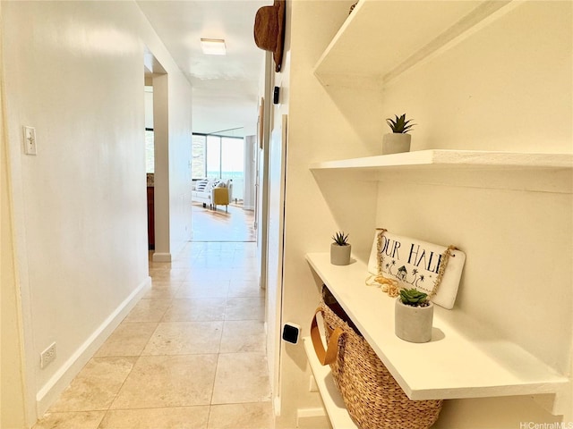 555 Hahaione St Unit 10F, Honolulu, HI 96825 - hallway featuring baseboards and light tile patterned floors