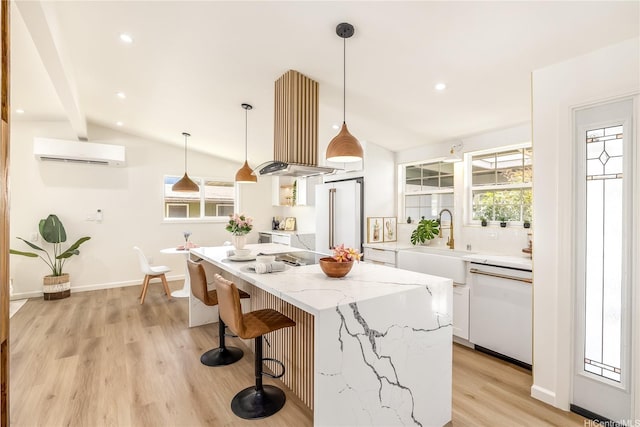 kitchen featuring white cabinets, a kitchen breakfast bar, white appliances, and a wall unit AC